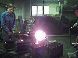 Melted bronze poured into the dies